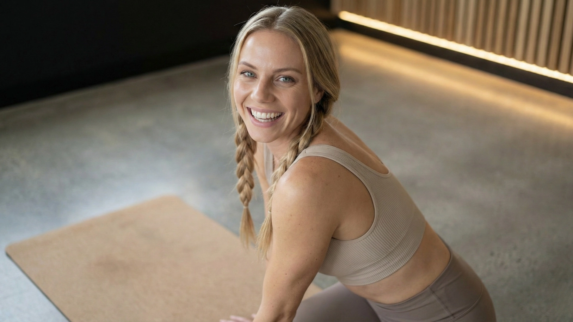 Anna Sinclair-Sorenson practicing yoga on mat, embodying movement as medicine and wellness transformation